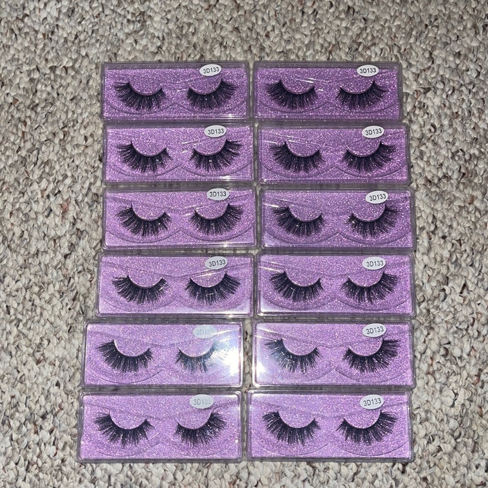 12 NEW pairs of false lashes.